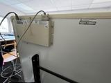 a refrigerator that is in the middle of a room