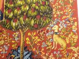 a picture of a tapestry hanging on a wall