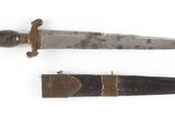 two different types of knives on a white surface