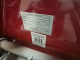 a close up of a red truck with a sticker on it ' s side