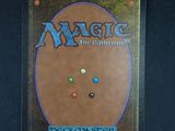 a close up of a card game cover with buttons on it