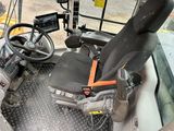 a seat in the driver ' s seat of a bus