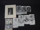 a lot of old photos of women on the table