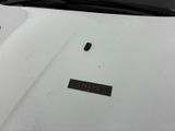 a sticker on the hood of a white car