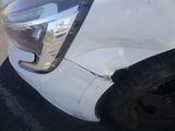 a picture of a car that has a dent in it