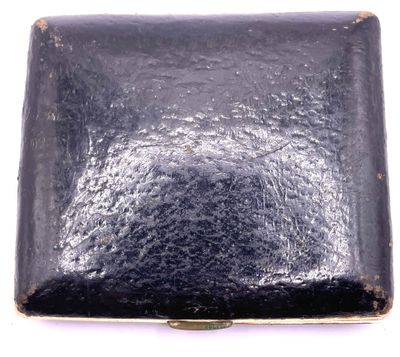 a black box that is sitting on a white surface