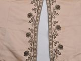 a close up of a pair of pants with flowers on them