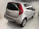 a small silver car parked in a garage