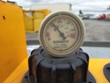 a close up view of a gauge on a construction vehicle