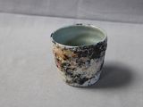 a small cup that is sitting on a table
