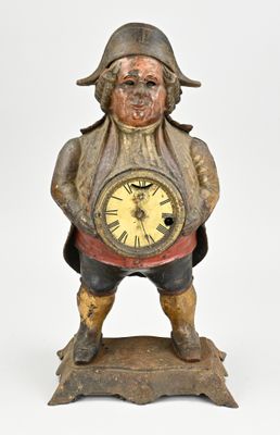 a statue of a man holding a clock in his hands
