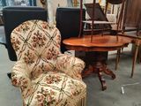 a chair that is sitting in front of a table