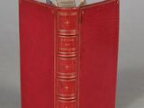 a red book that is open on a table