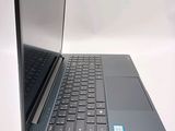a laptop computer sitting on top of a white table