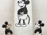 three figurines of mickey mouse and mickey mouse