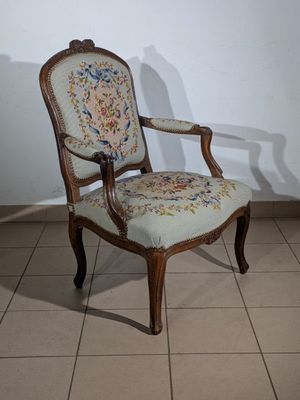 a chair that is sitting on a tile floor