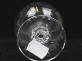 a close up of a wine glass with a label on it