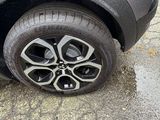 a close up of a car ' s tire on the street