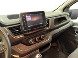 the interior of a car with a touch screen and steering controls