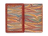 an open book with a red cover and a multicolored pattern