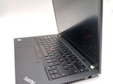 a laptop that is sitting on a white surface
