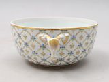 an image of a white and gold bowl with a bird on it