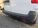 a white van that is parked on the side of the road