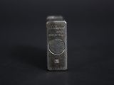 a close up of a silver bar on a black background