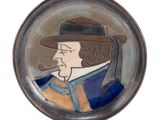 a picture of a picture of a man with a hat and a pipe