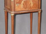 a small wooden table with a drawer on top of it