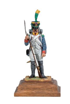 a figurine of a soldier in uniform with a sword