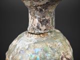 a close up of a vase on a black background