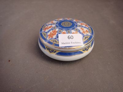 a close up of a small blue and white box with a tag on it