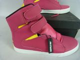 a pair of pink shoes with yellow trims on them