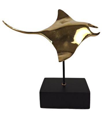 an image of a bronze statue of a manta ray on a black base