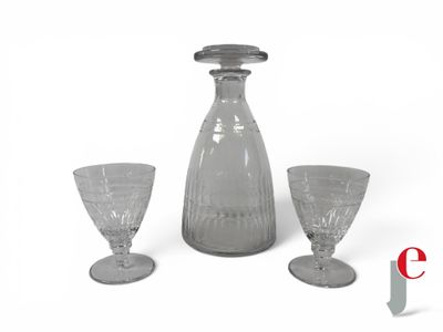three wine glasses and a decanter on a white background