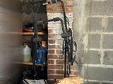a pile of trash in a room with a brick wall