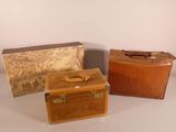three suitcases sitting next to each other on a table