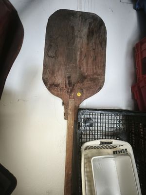 a wooden spatula next to a sink in a room