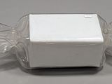a white box with two empty glasses on top of it