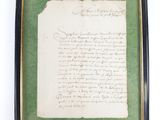 an old document with writing on a green background in a black frame