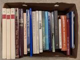 a box full of books that are sitting on the floor