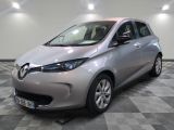 an image of a silver electric car in a showroom