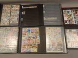 many different types of stamps on the pages of a binder