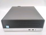 an image of a silver computer with a blue sticker on the side of it