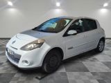 a picture of a small white car parked in a garage
