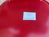 a red chair that has a sticker on it