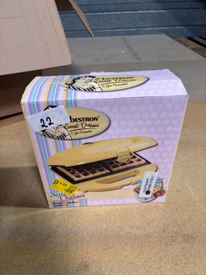a box that has a sandwich in it on the table