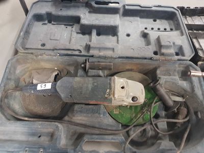 a tool in the case that is sitting on the floor