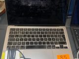 two laptops that are sitting on a table